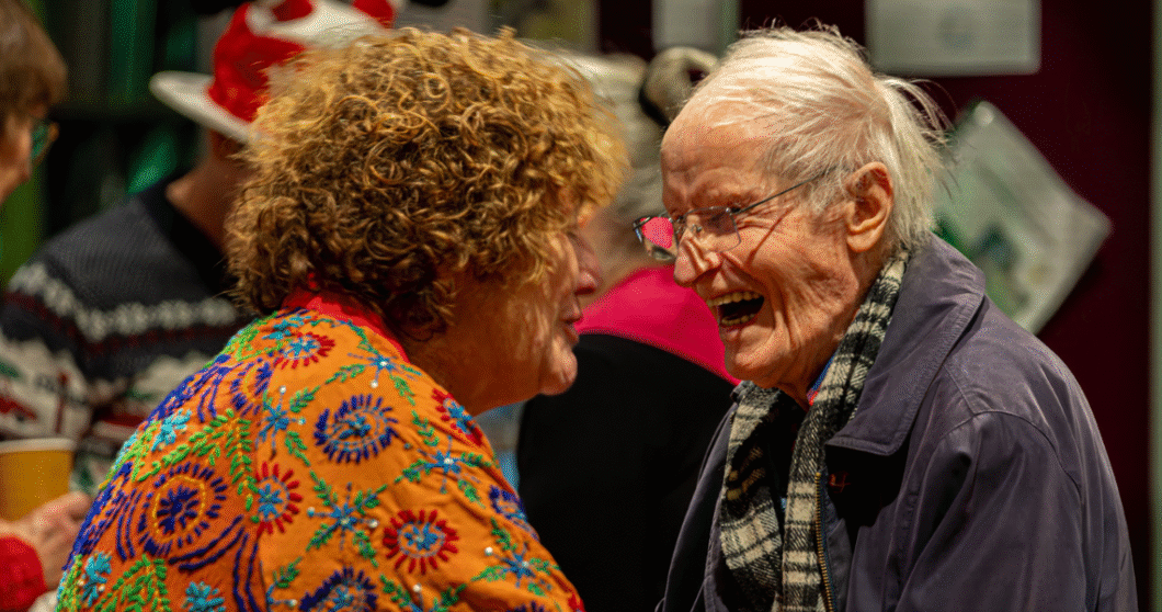 CO of Age Concern Epsom & Ewell talks with a client.